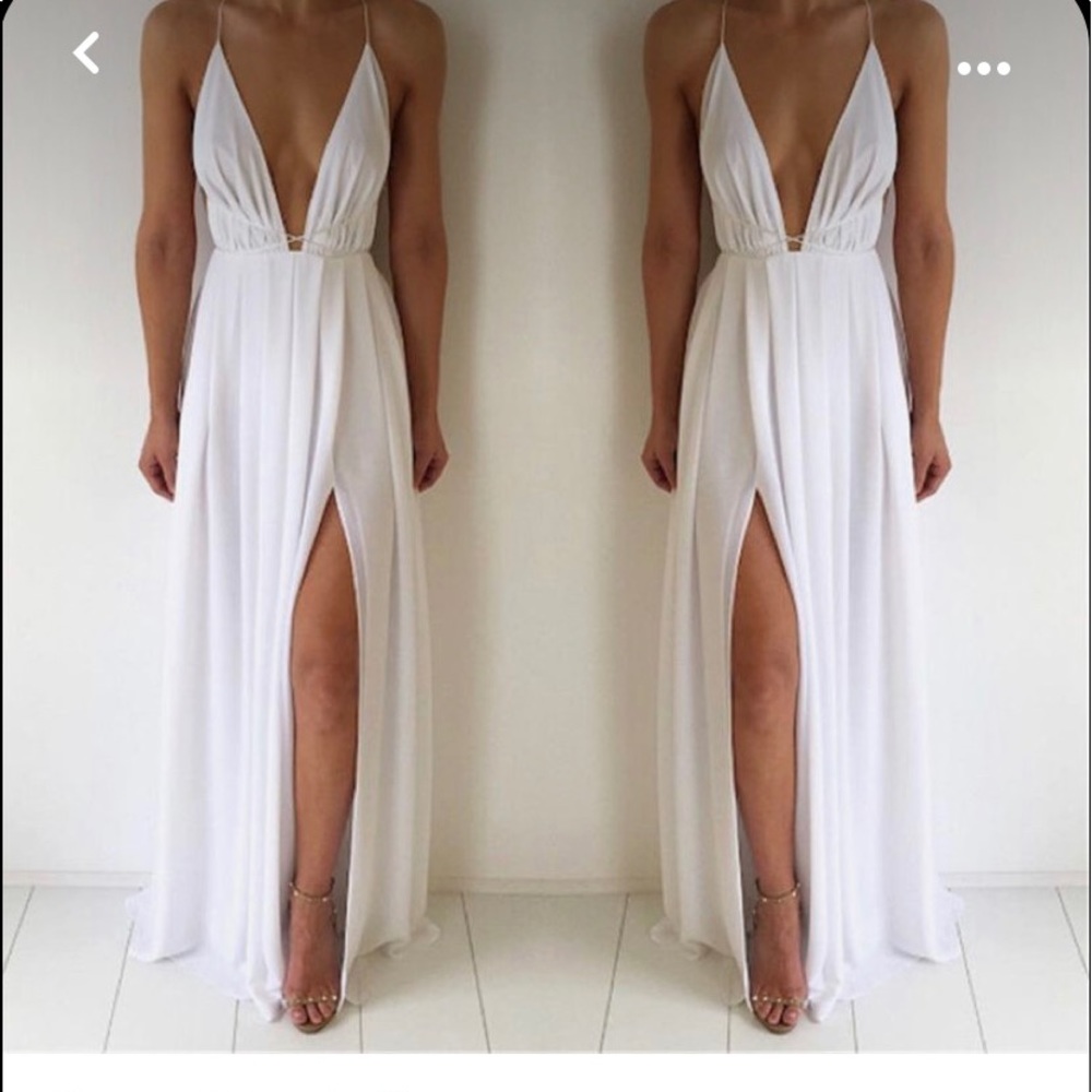 White chiffon dress with slit in the front.